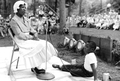 Annie Tomlin telling a story while a boy listens- White Springs, Florida