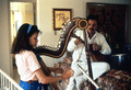 Ana Maria DeArmas playing the Venezuelan harp as Jesus Rodriguez accompanies on guitar- Naples, Florida