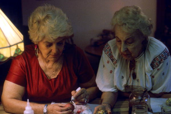 Ola Kryway guiding her apprentice, Mary Martin, in applying beeswax to an egg - Titusville, Florida.