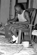 Alphonso Jennings splitting white oak in order to make a basket - Lamont, Florida