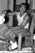Alphonso Jennings showing a completed white oak basket - Lamont, Florida