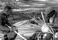 Apprentice Michael Steen (R) making a white oak basket as Alphonso Jennings looks on - Lamont, Florida