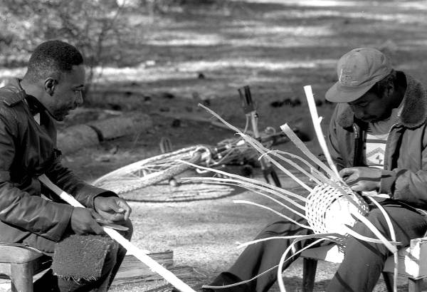 Apprentice Michael Steen (R) making a white oak basket as Alphonso Jennings looks on - Lamont, Florida