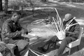 Apprentice Michael Steen (R) making a white oak basket as teacher Alphonso Jennings cuts white oak into strips - Lamont, Florida