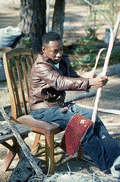 Alphonso Jennings stripping a white oak tree in order to make baskets - Lamont, Florida