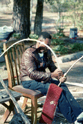 Alphonso Jennings stripping a white oak tree in order to make baskets - Lamont, Florida