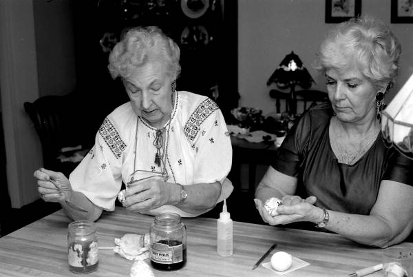 Ola Kryway (L) and apprentice Mary Martin decorating eggs using the Ukrainian pysanky technique - Titusville, Florida.