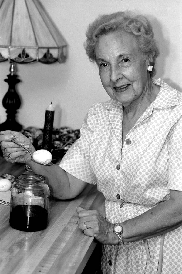 Ola Kryway dyeing an Easter egg - Titusville, Florida.