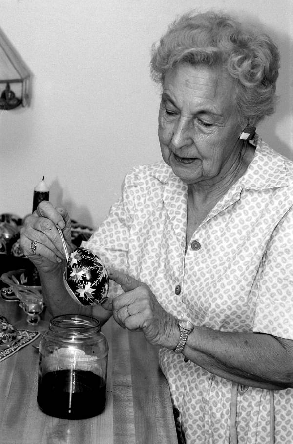 Ola Kryway dyeing an Easter egg - Titusville, Florida.