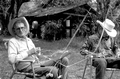 Cow whip maker George "Junior" Mills (l) and his apprentice J. Taylor Marcus making whips - Okeechobee, Florida.