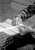 Close-up of Max Dooley making a cast net - Lakeland, Florida.