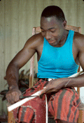 Alphonso Jennings cutting a strip of white oak for basket making - Lamont, Florida