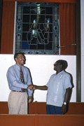 Hymn liner Troy Demps, right, shakes hands with apprentice Brian Wright - Orlando, Florida.