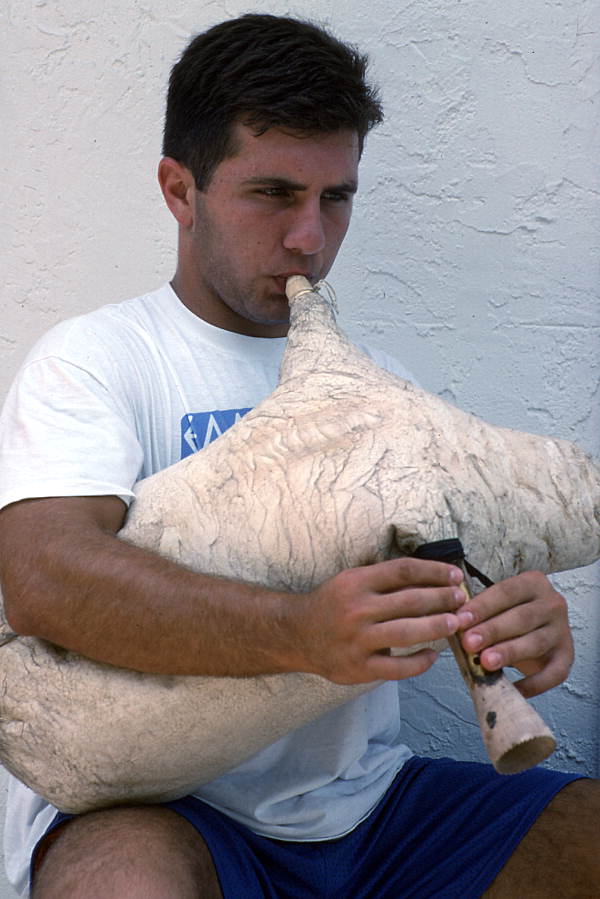 Nikitas Kavouklis, apprentice to his great uncle Nikitas Tsimouris, plays the Greek bagpipe, called a tsabouna - Tarpon Springs, Florida