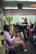 Musician Washboard Bill Cooke playing the ukelele at Lake Park Elementary School - Lake Park, Florida.