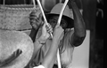 Basket maker Lucreaty Clark splitting white oak strips at the 1984 Florida Folk Festival - White Springs, Florida