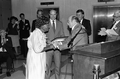 Basket maker Lucreaty Clark accepting the 1985 Folk Heritage Award from Secretary of State George Firestone - Tallahassee, Florida.