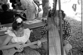 Jesus Rodriguez playing Venezuelan harp and his apprentice Ana Maria de Armas playing cuatro at the 1988 Florida Folk Festival - White Springs, Florida