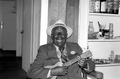 William "Washboard Bill" Cooke poses with his ukulele