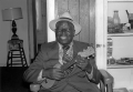 William "Washboard Bill" Cooke poses with his ukulele