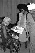 Mary McClain giving out calendars - Williston, Florida