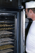 Baker Howard Goren showing baked goods in freezer - Miami Beach, Florida.