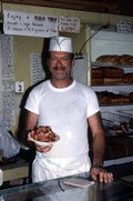 Baker Howard Goren showing tayglach, a Rosh Hashanah dessert - Miami Beach, Florida.