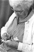 Woman painting a pysanky egg