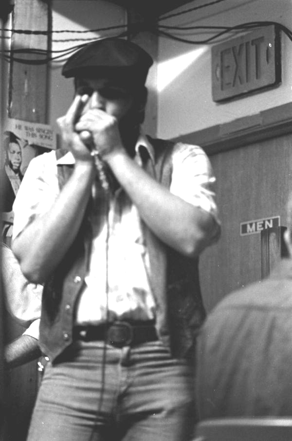 Harmonica player Mickey Seretny practicing before concert at The Stuffed Pepper - Saint Petersburg, Florida.
