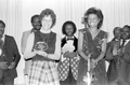 Doris Dyen, a folklorist receiving plaque from Betty Holzendorf during Triumphant Gospel Singers Association quartet reunion concert at Masonic lodge - Jacksonville, Florida.