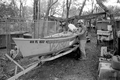 Minorcan crab fisherman Larry Hinman standing next to his boat : Saint Augustine, Florida