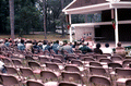 Jean Ritchie playing an autoharp while the crowd listens - White Springs, Florida