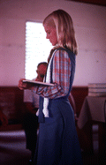 Girl singing from the Sacred Harp book at the Bethlehem Primitive Baptist Church - Old Chicora, Florida