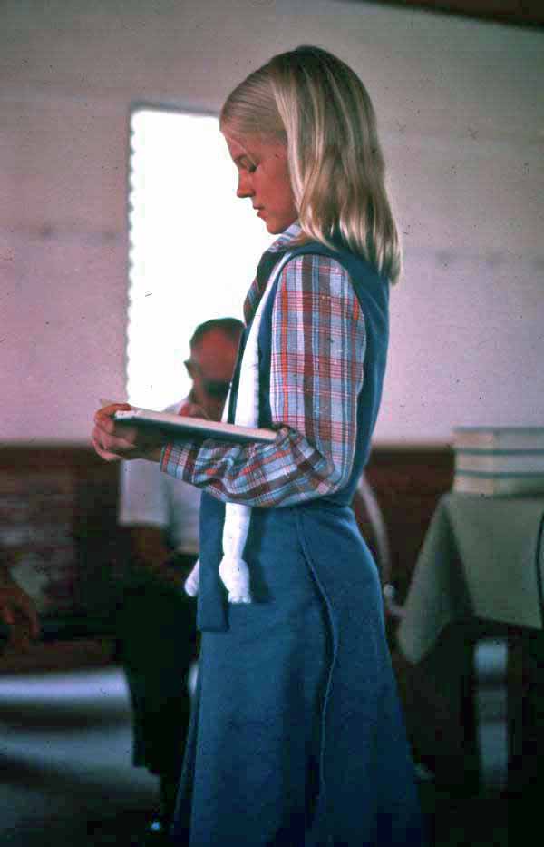 Girl singing from the Sacred Harp book at the Bethlehem Primitive Baptist Church: Old Chicora, Florida  (not after 1978)