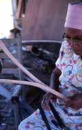 Basket maker Lucreaty Clark with strips of white oak