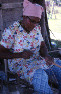 Basket maker Lucreaty Clark holding white oak strips