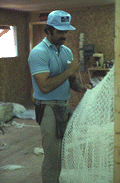 Billy Burbank III beginning the making of a fishing net - Fernandina Beach, Florida