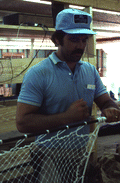 Billy Burbank III weaving a fishing net - Fernandina Beach, Florida