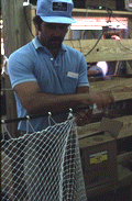 Billy Burbank III finishing the making of a fishing net - Fernandina Beach, Florida