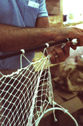 Billy Burbank III weaving a fishing net - Fernandina Beach, Florida