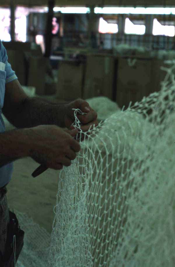 Billy Burbank III in process of making a fishing net - Fernandina Beach, Florida