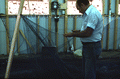 Billy Burbank II repairing a fishing net - Fernandina Beach, Florida