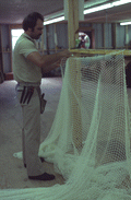 Billy Burbank III working on a fishing net - Fernandina Beach, Florida