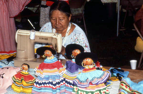 Annie Jimmie sewing, with examples of Seminole dolls (1982)