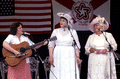 Evelyne Bernstein and Thelma Boltin singing folk songs while Betsy Bouwhiuzen plays guitar - White Springs, Florida