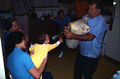 Nikitas Tsimouris playing a tsambouna for his family - Tarpon Springs, Florida
