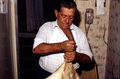 Nikitas Tsimouris preparing to play a tsambouna - Tarpon Springs, Florida