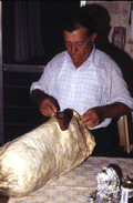 Nikitas Tsimouris preparing to play a tsambouna - Tarpon Springs, Florida