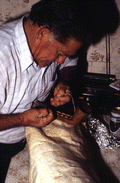Nikitas Tsimouris preparing to play a tsambouna - Tarpon Springs, Florida