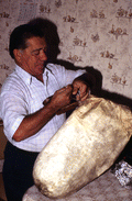 Nikitas Tsimouris preparing to play a tsambouna - Tarpon Springs, Florida